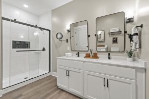 Modern bathroom with dual vanity and custom lighting