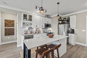 Luxury white kitchen with island seating